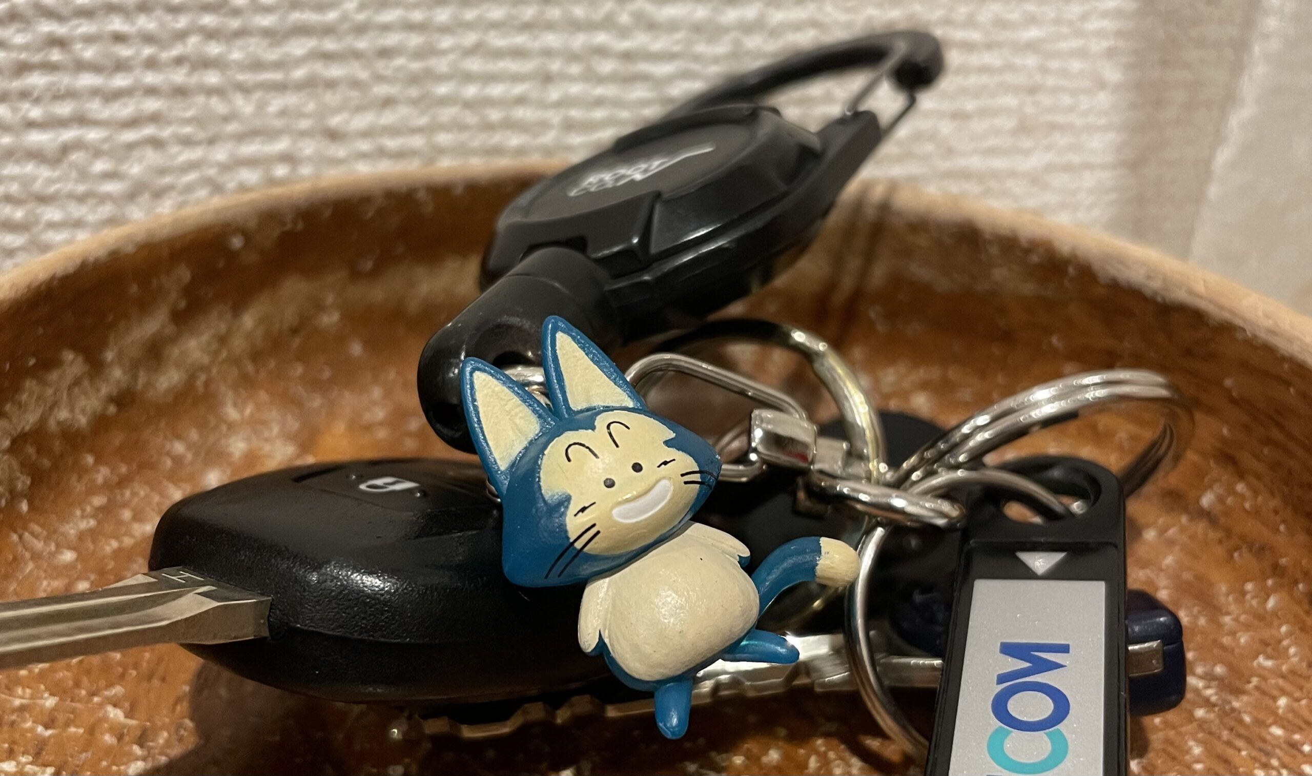 キーホルダーとして付いているカプセルトイで取ったドラゴンボールのプーアルの画像